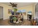 Home office with natural light, ceiling fan, hardwood floors, and stylish decor at 3641 Gleneagle Dr # 12D, Sarasota, FL 34238