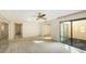 Spacious bedroom with natural light, a ceiling fan, carpet, and sliding glass doors to a patio at 3692 Glen Oaks Manor Dr, Sarasota, FL 34232