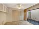 Cozy bedroom features ample closet space and private lanai access via sliding glass doors at 3692 Glen Oaks Manor Dr, Sarasota, FL 34232