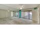 Spacious bedroom with carpet flooring, ceiling fan, access to an ensuite and sliding door access to the screened lanai at 3692 Glen Oaks Manor Dr, Sarasota, FL 34232