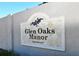 Elegant 'Glen Oaks Manor' community sign with decorative details and landscaping at 3692 Glen Oaks Manor Dr, Sarasota, FL 34232