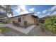 Charming single-story home with landscaped front yard, attached garage and inviting entrance at 3692 Glen Oaks Manor Dr, Sarasota, FL 34232