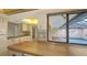 Updated kitchen overlooking a private outdoor pool area, perfect for indoor-outdoor living at 3692 Glen Oaks Manor Dr, Sarasota, FL 34232
