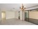 Open-concept living room with tiled flooring, a ceiling fan, and sliding glass doors to the lanai at 3692 Glen Oaks Manor Dr, Sarasota, FL 34232