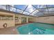 Bright enclosed pool offers a sunny spot for swimming, with easy access to the home's interior spaces at 3692 Glen Oaks Manor Dr, Sarasota, FL 34232