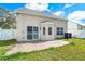 Exterior view of backyard with patio, green grass, and partial view of the house at 3831 Day Bridge Pl, Ellenton, FL 34222