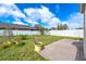 Spacious backyard featuring a well-maintained lawn, patio, and partial privacy fence at 3831 Day Bridge Pl, Ellenton, FL 34222