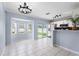 Bright dining area featuring a stainless steel refrigerator, sliding glass doors, and a bay window at 3831 Day Bridge Pl, Ellenton, FL 34222
