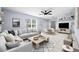 Bright living room featuring a modern ceiling fan, window, neutral décor, and tiled flooring at 3831 Day Bridge Pl, Ellenton, FL 34222