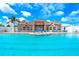Resort style swimming pool with chairs, a beautiful clubhouse, and palm trees at 3831 Day Bridge Pl, Ellenton, FL 34222