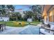 Large backyard with seating, fire pit and outbuildings, great for outdoor enjoyment at 4045 Lisbon Pl, Sarasota, FL 34231