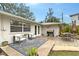 Inviting backyard patio with grill, dining, and seating areas, perfect for outdoor entertaining at 4045 Lisbon Pl, Sarasota, FL 34231