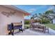Backyard patio with a grill, dining and gazebo, perfect for outdoor entertaining at 4045 Lisbon Pl, Sarasota, FL 34231