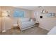 Bright bedroom with pink walls, neutral accents, carpeted floors, and a window at 4045 Lisbon Pl, Sarasota, FL 34231