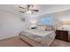Inviting bedroom with neutral tones features a comfortable bed, bedside tables, and a ceiling fan for a calm atmosphere at 4045 Lisbon Pl, Sarasota, FL 34231