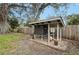 Well-maintained backyard chicken coop with covered run and easy access at 4045 Lisbon Pl, Sarasota, FL 34231