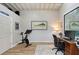 Bright exercise room features wood floors, shiplap walls, exercise bike and weight rack at 4045 Lisbon Pl, Sarasota, FL 34231