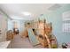 The playroom has a large wooden playset with a slide, ladder, and climbing wall and views to another room at 4045 Lisbon Pl, Sarasota, FL 34231
