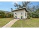 Well-maintained shed in a lush backyard with a charming walkway, tasteful landscaping, and a peaceful setting at 4045 Lisbon Pl, Sarasota, FL 34231