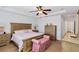 Bedroom with tray ceiling, fan, wood furniture, and carpet at 4222 Overture Cir # 4222, Bradenton, FL 34209