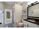 Bathroom featuring granite counters, white vanity, and a glass enclosed shower leading to the pool at 4255 67Th Avenue E Cir, Sarasota, FL 34243