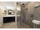 Modern bathroom featuring a glass-enclosed shower with a rainfall shower head and built-in niche at 4255 67Th Avenue E Cir, Sarasota, FL 34243