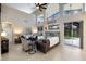 Open living room with high ceilings, arched windows, tile floors, and comfortable furnishings at 4255 67Th Avenue E Cir, Sarasota, FL 34243