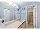 Well-lit bathroom features a large mirror, vanity, and walk-in shower at 4414 Spicewood Dr # H, Bradenton, FL 34208