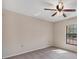 Comfortable bedroom with neutral walls, a ceiling fan, and a window at 4414 Spicewood Dr # H, Bradenton, FL 34208