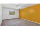 Bright bedroom featuring neutral carpet and a colorful wall at 4414 Spicewood Dr # H, Bradenton, FL 34208