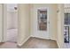 Bright foyer featuring durable vinyl floors and a storm door with glass at 4414 Spicewood Dr # H, Bradenton, FL 34208