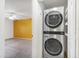 Convenient in-unit stacked washer and dryer near the bedroom at 4414 Spicewood Dr # H, Bradenton, FL 34208