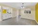Inviting living room featuring sleek flooring, recessed lighting, and a stylish chandelier at 4414 Spicewood Dr # H, Bradenton, FL 34208