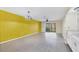 Bright living room with wood floors, ceiling fan, and sliding glass doors to the balcony at 4414 Spicewood Dr # H, Bradenton, FL 34208