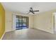 Bright living room with sliding glass doors offering natural light and outdoor views at 4414 Spicewood Dr # H, Bradenton, FL 34208