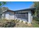 The screened patio offers outdoor living space and view of the landscaped yard at 4455 Emerald Ridge Dr, Sarasota, FL 34233