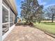 Charming brick patio and huge tree in private backyard that is ideal for outdoor enjoyment and relaxation at 4744 105Th E Ave, Parrish, FL 34219