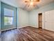 Bedroom featuring a closet with closet system, hardwood-style floors and a large window at 4744 105Th E Ave, Parrish, FL 34219