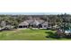Aerial shot of the community center featuring manicured lawns, a pool, and lush landscaping at 4744 105Th E Ave, Parrish, FL 34219