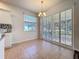Dining area featuring plantation shutters offering natural light and convenient access to kitchen at 4744 105Th E Ave, Parrish, FL 34219