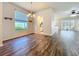 Bright dining area with wood floors, open to living spaces, featuring modern accents at 4744 105Th E Ave, Parrish, FL 34219