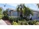 Charming single-story home with manicured landscaping, green lawn, and beautiful curb appeal at 4744 105Th E Ave, Parrish, FL 34219