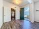 Inviting foyer with hardwood floors and a view through to the lush front yard at 4744 105Th E Ave, Parrish, FL 34219