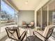 Cozy screened-in lanai with comfortable seating, perfect for enjoying outdoor relaxation at 4744 105Th E Ave, Parrish, FL 34219