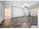 Spacious living room featuring modern wood floors, white walls, and ceiling fan at 4744 105Th E Ave, Parrish, FL 34219