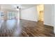 Open living area offering tile flooring, white walls, and access to the outdoor area at 4744 105Th E Ave, Parrish, FL 34219