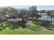 Aerial view of community playground featuring a variety of colorful play structures, benches, and safety fencing  at 4744 105Th E Ave, Parrish, FL 34219
