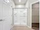 Bathroom featuring a clear glass walk-in shower with a modern shower head and built-in shelves at 4744 105Th E Ave, Parrish, FL 34219