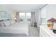 Cozy bedroom with neutral tones, two windows, and soft carpet at 5118 78Th St E Cir, Bradenton, FL 34203