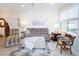 Bright living room features neutral tones, comfortable seating, and natural light from the large window at 5118 78Th St E Cir, Bradenton, FL 34203
